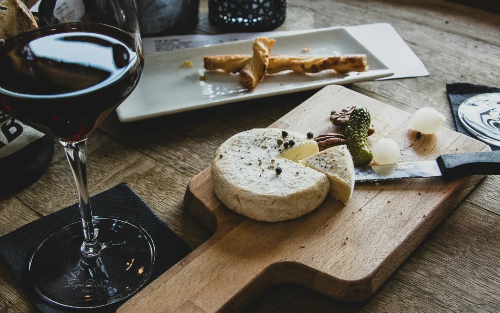 Glass of red wine with charcuterie board