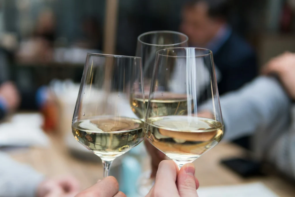 People toasting with white wine