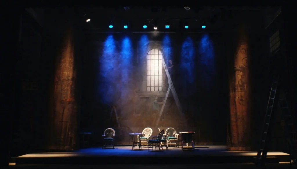 A set of chairs and tables at a theatre