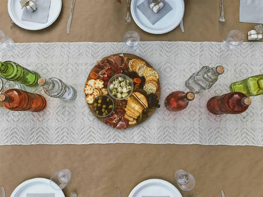 A table with charcuterie and different bottles